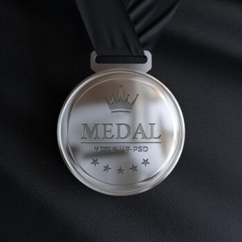 Free PSD | Silver medal mockup on black fabric