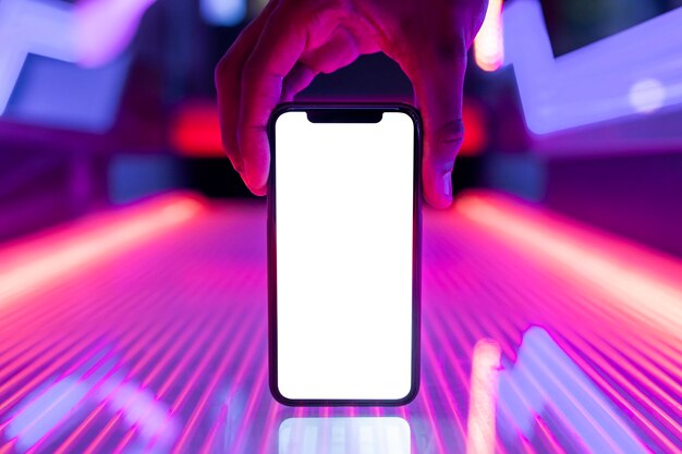 Free PSD | Smartphone screen mockup on glowing neon lights