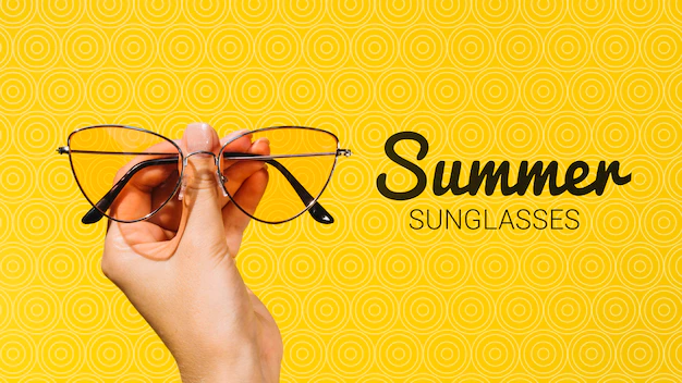 Free PSD | Summer fashion sunglasses held in hand