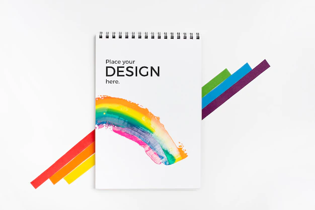 Free PSD | Top view of rainbow colors with notebook