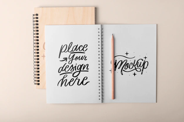 Free PSD | Top view over spiral notebook mockup