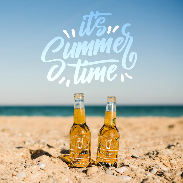 Free PSD | Two bottles on the beach with copy space