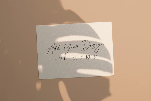 Free PSD | White card mockup shadow overlay monstera leaves
