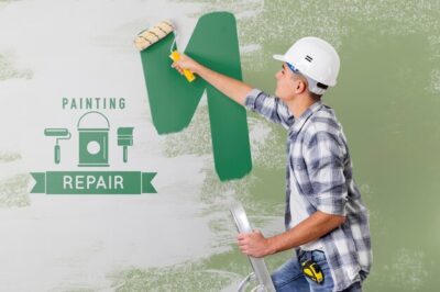 Free PSD | Young handyman painting the wall in green