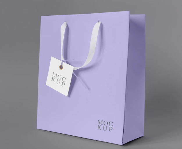 Free PSD | Front view of paper shopping bag mock-up with paper tag