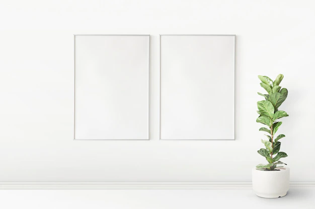 Free PSD | Picture frame mockup psd hanging in a minimal living room