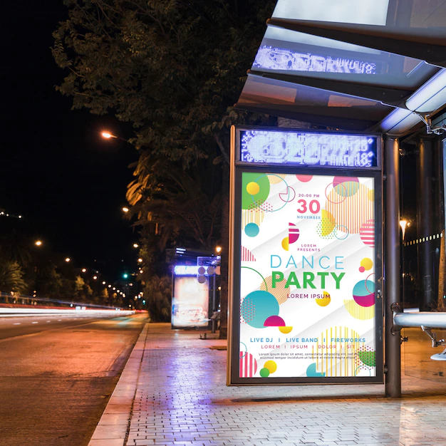 Free PSD | Bus stop billboard mockup in city at night