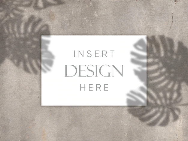 Free PSD | Editable mock up design with blank card on concrete texture with shadow overlay background