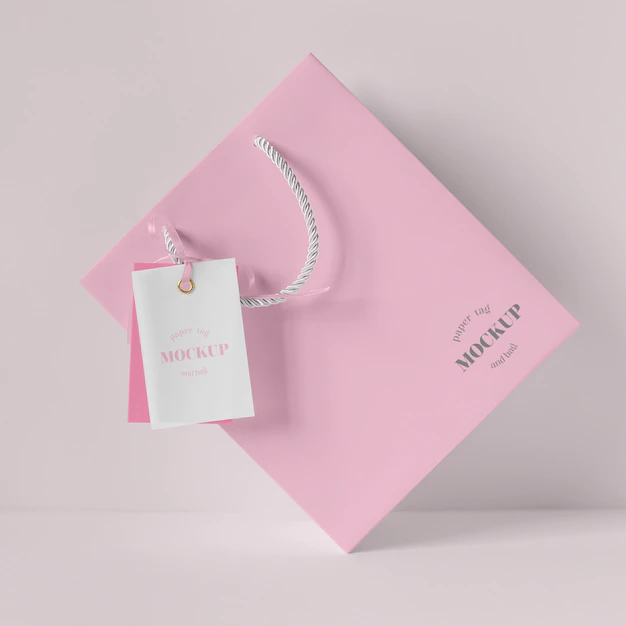 Free PSD | Front view of paper shopping bag mock-up with paper tag