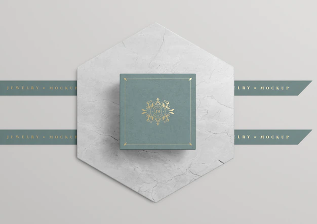 Free PSD | Green jewelry box on marble with golden symbol
