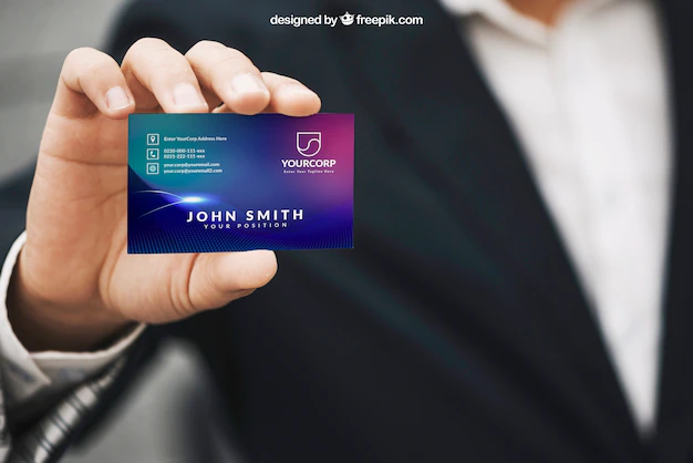 Free PSD | Man holding business card mockup