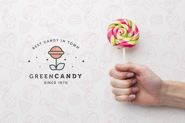 Free PSD | Mock-up hand with tasty lollipop