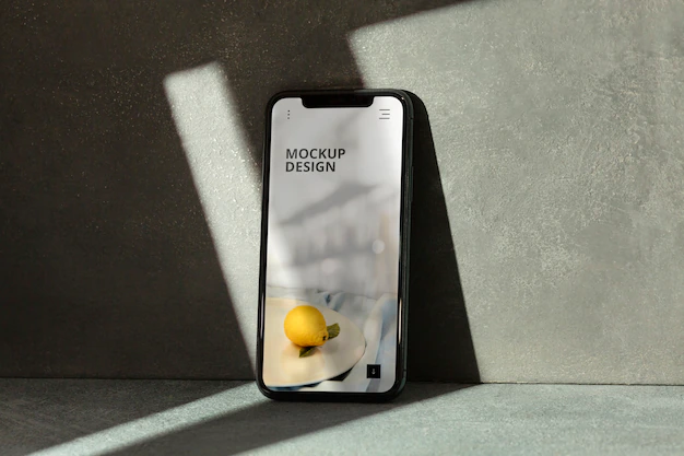 Free PSD | Phone on concrete wall with shadow