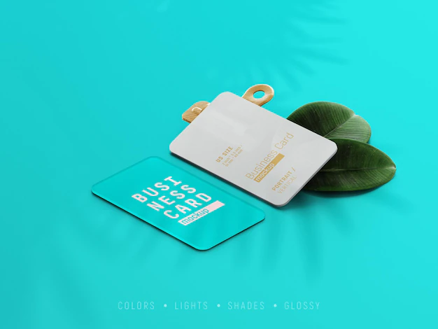 Free PSD | Rounded corner business card mockup scene with paper clip and leaves