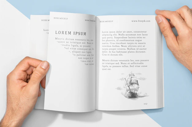 Free PSD | Top view hand on book mock-up