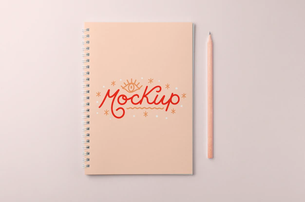 Free PSD | Top view over spiral notebook mockup