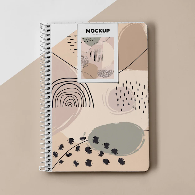 Free PSD | Top view poster mockup and notebook