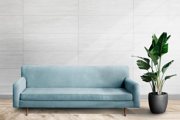 Free PSD | Wall mockup psd with blue sofa in living room