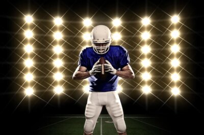 Free Photo | Football player with a blue uniform in front of lights