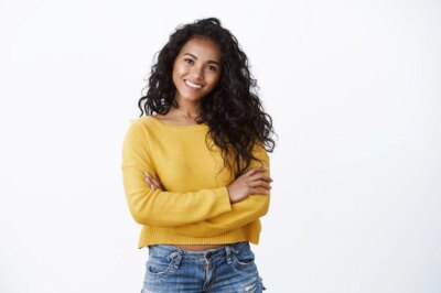 Free Photo | Happiness, wellbeing and confidence concept. cheerful attractive african american woman curly haircut, cross arms chest in self-assured powerful pose, smiling determined, wear yellow sweater
