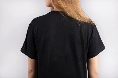 Free Photo | Young female wearing a black short sleeve t-shirt with a white wall in the background