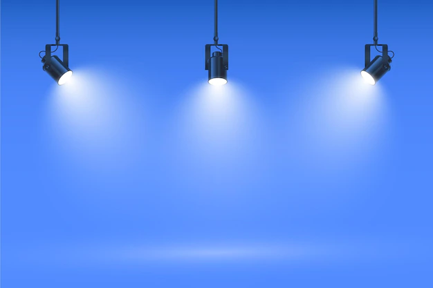 Free Vector | Spot lights on studio blue wall background