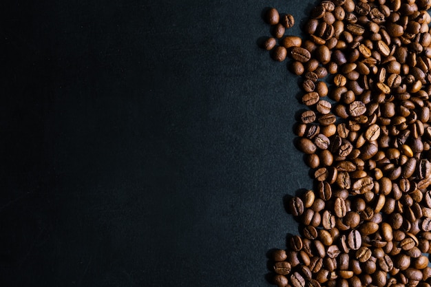 Free Photo | Coffee beans on dark background. top view. coffee concept.
