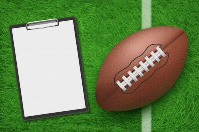 Free Vector | Rugby ball and clipboard lying on stadium green grass top view