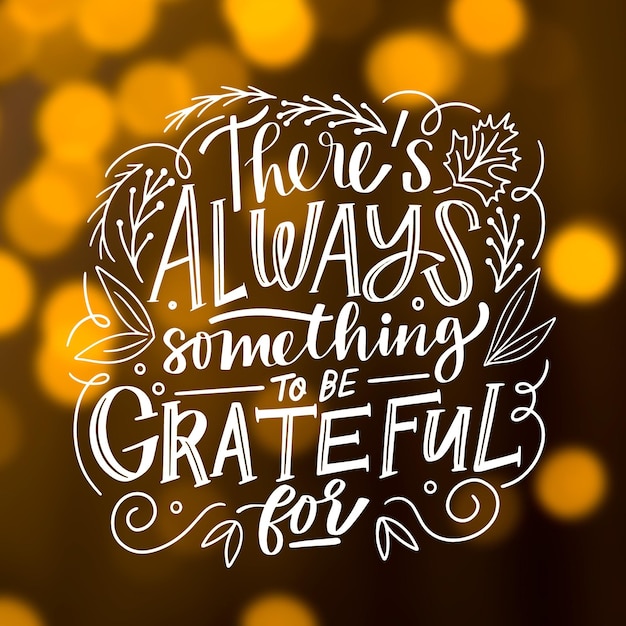 Free Vector | Thanksgiving lettering on blurred background