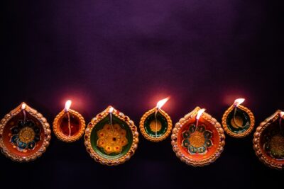 Free Photo | Happy diwali - beautiful diwali diyas at night with flowers