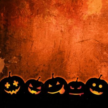 Free Photo | Orange grunge background for halloween with pumpkins
