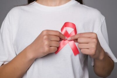 Free Photo | World breast cancer day concept,health care - woman wore white t-shirt with pink ribbon for awareness, symbolic bow color raising on people living with women's breast tumor illness