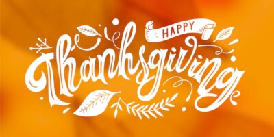 Free Vector | Happy thanksgiving lettering on blurred background