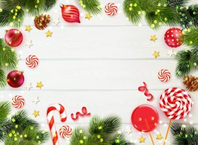 Free Vector | Realistic wooden table background framed with fir tree branches candies and christmas decorations