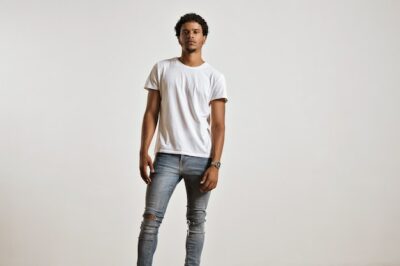 Free Photo | Full-body portrait of an athletic young male in ripped light blue jeans and blank white shortsleeve t-shirt