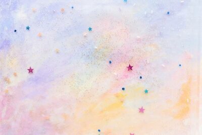 Free Photo | Glittery star confetti on colorful abstract pastel watercolor background