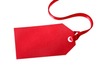 Free Photo | Red gift tag or price ticket with red ribbon isolated on white