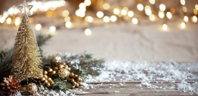 Free Photo | Winter cozy background with festive decor details, snow on a wooden table and bokeh. the concept of a festive atmosphere at home.
