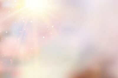 Free Vector | Sun flash over pink bokeh background.