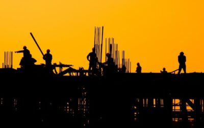 Free Photo | Construction workers at sunset.
