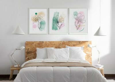 Free Photo | Interior design with photoframes and bed with pillows