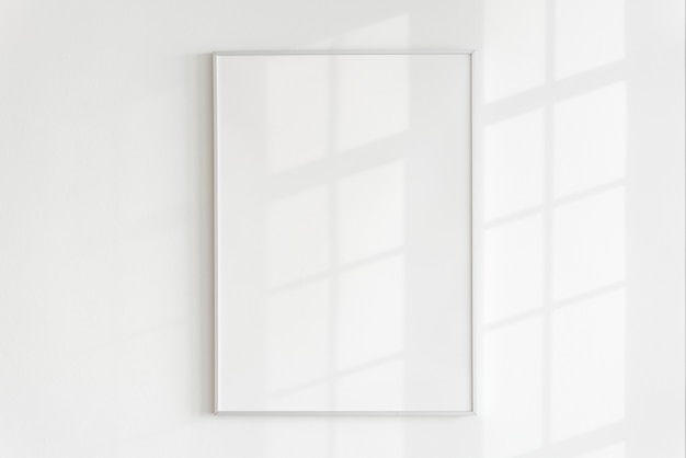 Free Photo | Blank frame on a wall with natural light