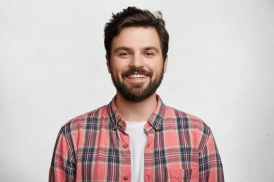 Free Photo | Young bearded man with striped shirt
