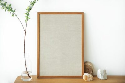 Free Photo | Blank wooden picture frame against a white wall