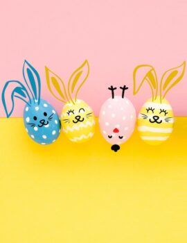 Free Photo | Easter eggs with painted face and copy space