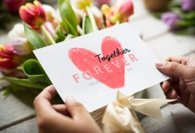 Free Photo | Bouquet of flowers with a together forever card